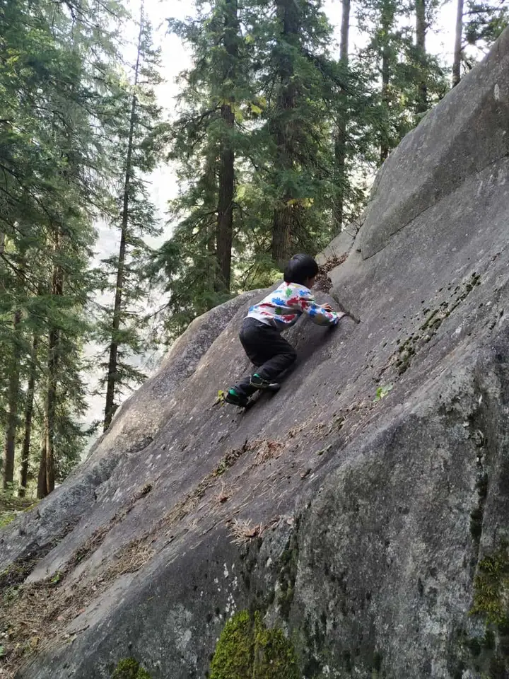 Dhillan's son climbing outdoors in Sethan, Manali