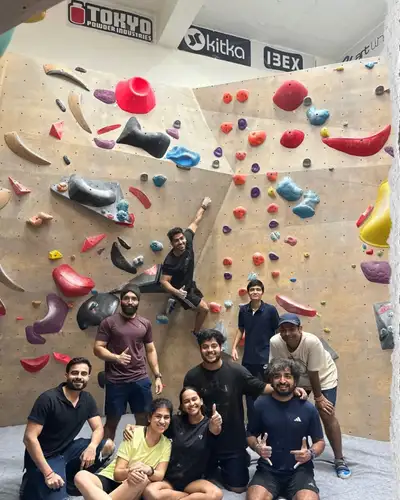 A group of friends at the bouldering wall