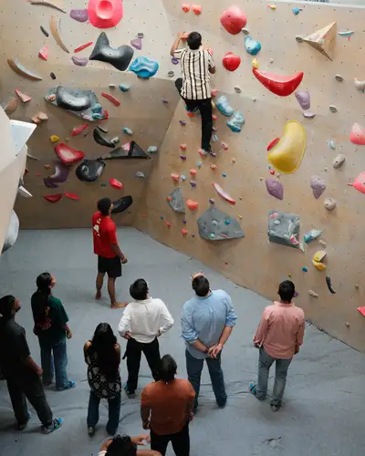 Friends at the foot of the wall watching a climber