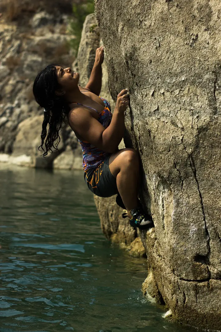 Prerna deep-water soloing on a lake.