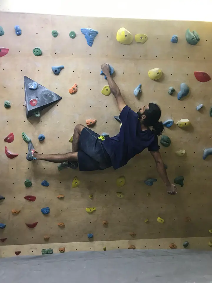 Dhillan flagging his right foot on the wall.
