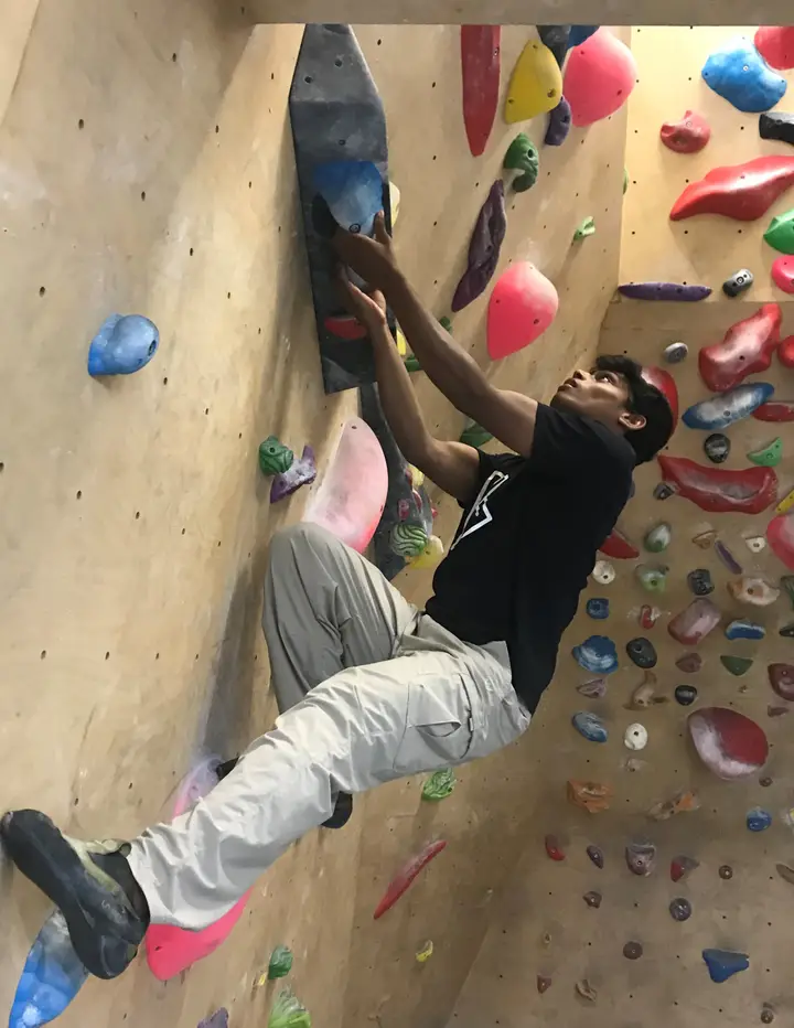 Arjun under-clinging on a blue hold on the volume.