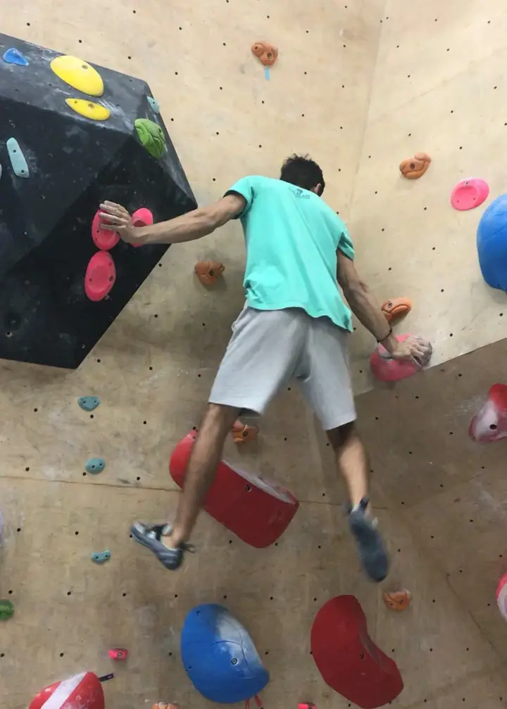 Varun using his palms to move up the route.