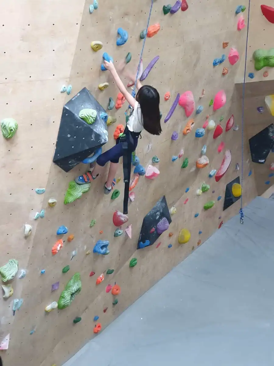 Kids climbing at a BoulderBox birthday party