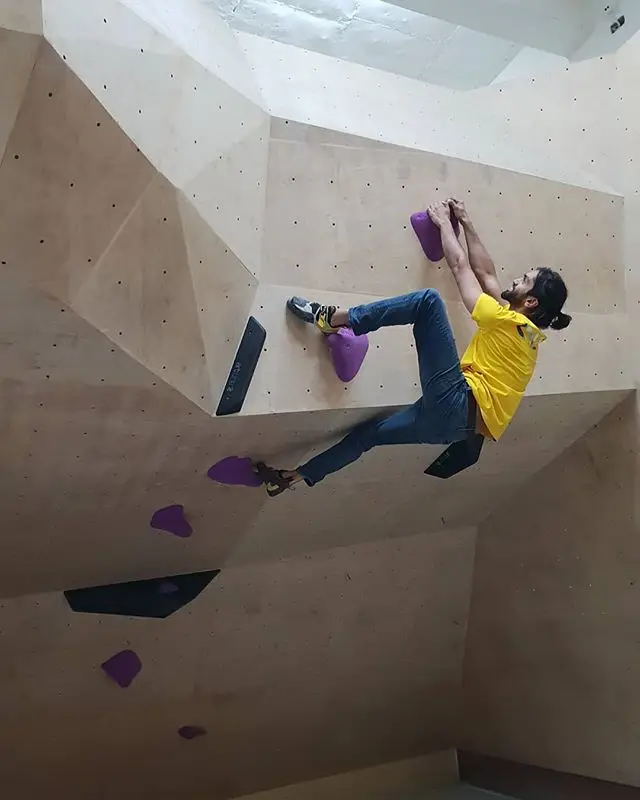 Yadu climbing the first route set at BoulderBox.
