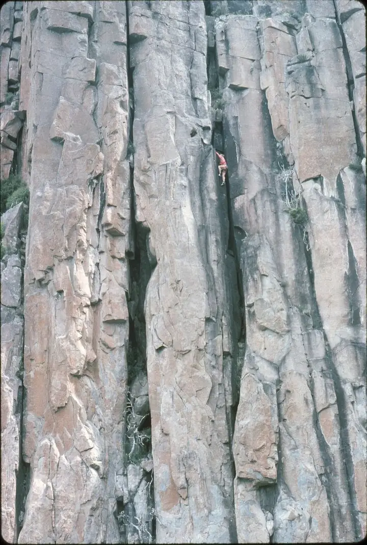 Bryan Kennedy solos the "Kennedy variant" direct start to Battlements Organ Pipes Mt Wellington Tasmania 1977. Organ Pipes, Mt Wellington - Battlements, Bryan Kennedy.jpg